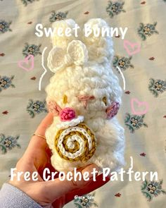 a hand holding a small white crochet bunny with the words sweet bunny free crochet pattern