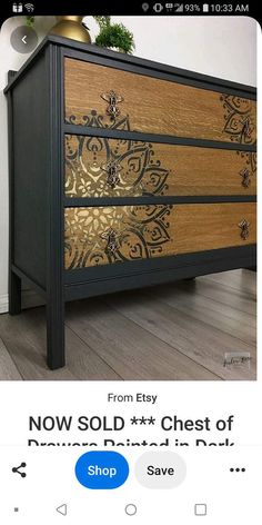 an old dresser has been painted gold and black with intricate designs on the drawers for sale