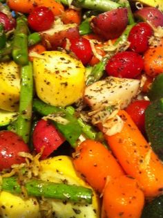 a salad with carrots, peppers and other vegetables