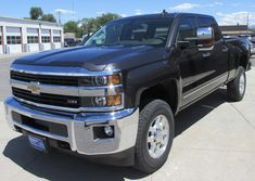 a black truck parked in a parking lot