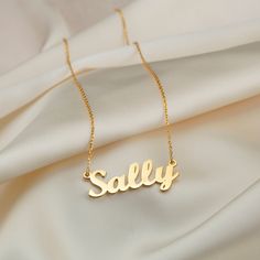 DETAILS: - Name necklaces are made of 925 silver - Dimensions of the pendant: width: approx. 3 cm, height: approx. 1 cm - Hypoallergenic - Express shipping is possible ✅ Personalization: This beautiful name necklace features some classic fonts that create a beautiful, perfectly balanced look when worn. Simply select a name and our skilled craftsmen will take care of every detail, creating a personalized name necklace that you can proudly wear yourself or give as a gift. ✅ Chain length: The speci White Gold Name Necklace Custom Name Gift, Custom Name White Gold Necklace Gift, Custom Name White Gold Necklace As A Gift, White Gold Necklaces With Name For Gift, White Gold Name Necklace For Birthday, Classic Name Necklace For Birthday, Customizable Yellow Gold Charm Necklace For Gift, White Gold Pendant Name Necklace Gift, Classic White Gold Name Necklace As Gift