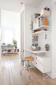 a white desk and chair in a room