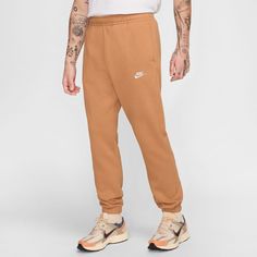 You can join the comfort club in the Nike Club Men's Fleece Cuff Pants. These sweatpants aren't like your standard sweats, making dress-down days stylish ones! These pants contour well to your body, giving you that "put together" look, but you get to have that lounge feel all day. Fit: Relaxed fit. Pants with cuffed ankles. Material: Brushed fleece (80% Cotton, 20% Polyester). Machine washable. Elastic waistband with functioning drawstring. One back hand pocket and two front pockets. Mens Nike Sweatpants, Dress Down Day, Cuff Pants, Nike Sportswear Club Fleece, Relaxed Fit Pants, Nike Sweatpants, Cuffed Pants, Nike Just Do It, Fleece Pants