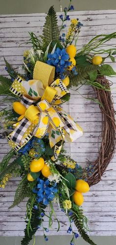 a wreath with yellow and blue flowers on it