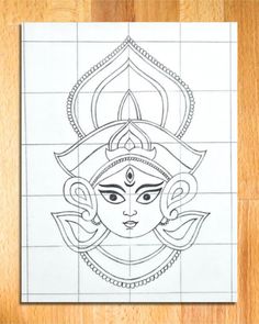 a drawing of the face of lord ganesha on a tile wall in front of a wooden floor