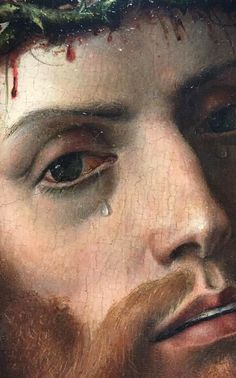 a close up of a painting of jesus with blood dripping from his eyes and beard