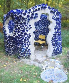 there is a blue and white sculpture in the woods