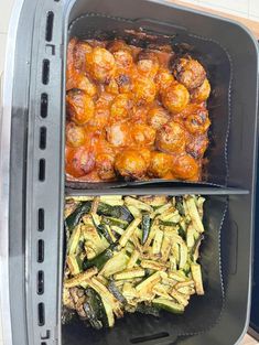 two plastic containers filled with food on top of a counter