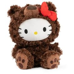 a brown hello kitty stuffed animal with a red bow on it's head and eyes