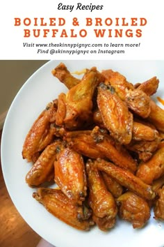 fried buffalo wings on a white plate with text overlay that reads easy recipes boiled and broiled buffalo wings