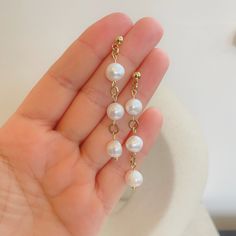 Add a touch of timeless elegance to your collection with these classic freshwater pearl hook earrings. Each earring features a lustrous freshwater pearl, renowned for symbolising purity and wisdom. Perfect for June birthdays, these pearls are also the birthstone for the month, making them a meaningful gift for yourself or a loved one. The delicate hook design ensures comfort and sophistication, suitable for any occasion. Elevate your style with these versatile and beautiful earrings. Materials : Akoya Pearl Dangle Earrings In Pearl White, Pearl White Akoya Pearl Dangle Earrings, Akoya Pearl Dangle Earrings, Akoya Pearl White Dangle Earrings, Akoya Pearl Dangle Earrings For Anniversary, Classic Bridal Earrings With Pearl Chain, Classic Pearl Linear Drop Earrings, Pearl Chain Earrings For Anniversary, Pearl White Akoya Pearl Earrings With Pearl Chain