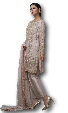 This salwar kameez is featured in georgette fabric. Shirt of this salwar kameez is embellished with zardozi work. Dupatta is in net fabric with all over sequin work and four-sided border. Trouser is in satin silk. Indian Fashion Salwar, Latest Anarkali Suits, Salwar Kameez Online Shopping, Floor Length Anarkali, Zardozi Work, Long Anarkali, Designer Anarkali Suits, Gotta Work, Gotta Patti