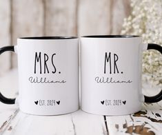 two black and white coffee mugs with mr and mrs names