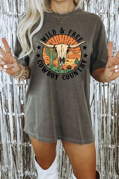 This Comfort Color cowboy t-shirt is a perfect blend of western flair and country charm. With its bold bull skull graphic and rustic design, it's an ideal gift choice for rodeo enthusiasts, country music lovers, and anyone looking to rock a cute and stylish western tee. 📌IMPORTANT: This is a regular fit T-shirt, if you want an oversized look, please size up.  ⭐️For the T-shirt dress look, size up at least 2 sizes. Please refer to size chart for specific shirt measurements.⭐️ 📌The Comfort Color Summer Graphic Tee For Western-themed Events, Fall T-shirt With Graphic Print For Rodeo, Graphic Print T-shirt For Rodeo In Fall, Western Graphic Print Tops For Western-themed Events, Graphic Tee For Western-themed Fall Events, Summer Crew Neck T-shirt For Western-themed Events, Graphic Tee With Screen Print For Western-themed Events, Western Style Screen Print Tops For Western-themed Events, Western Tops With Screen Print For Western-themed Events