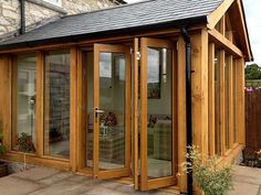 a wooden building with glass doors and windows