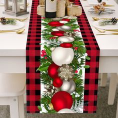 a christmas table runner with ornaments on it