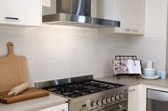 a stove top oven sitting inside of a kitchen