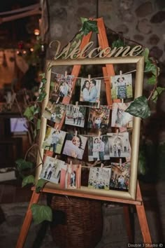 a wooden easer with pictures on it sitting in front of a sign that says welcome