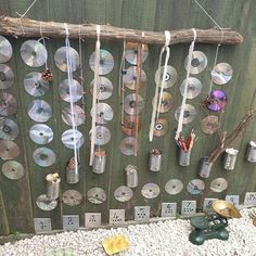 there are many cds hanging on the wall