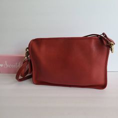 "Vtg Coach Original Companion Bag Red leather with anchor stamp brass hardware Roomy interior with slip pocket Secured by a top Talon Zipper Two front slip pockets Hang tag and ball chain Removable 33.5\" strap Measures: 11\"L, 7.5\"H, 2.5\"W Made in New York City, USA #092-2605 Flaw: discoloration on zipper pull (typical from age) Cleaned, conditioned and ready to wear! Questions? Just ask! More vtg Coach styles/colors available G68a" Classic Red Bags With Brass Hardware, Red Travel Bag With Brass Hardware, Red Shoulder Bag With Brass Hardware For Everyday Use, Olive Green Top, Vintage Coach, Tiffany Blue, Custom Bags, Super Sweet, Vintage Bags