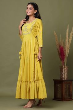 Cotton Yellow Anarkali Style Embroidered Gown | Best Indian Ethnic wear Online USA | Festive Straight Kurta Sharara With Tassels, Festive Sharara With Tassels And Straight Kurta, Festive Kurta With Tassels, Festive Bollywood Kurta With Tassels, Traditional Anarkali Set With Tassels For Designer Wear, Diwali Anarkali Set With Straight Kurta And Tassels, Diwali Anarkali Set With Tassels And Straight Kurta, Cotton Kurta With Tassels For Navratri, Diwali Anarkali Set With Tassels