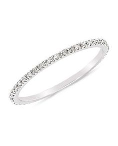 a white gold wedding band with diamonds