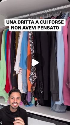 a man is sitting in front of a closet full of shirts and pants, with the caption'una dirita a cui fofose no avevi pensato '