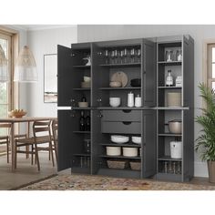 an open cabinet in the middle of a dining room with dishes and utensils