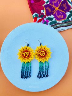 These beaded Mexican earrings are so colorful and perfect for all-day wear. They are definitely the perfect accessory to style up your look and add personality to your outfit. These lovely handmade beaded earrings are made with silver plated hooks (nickel free) and high-quality colorful beads. Finds more styles at https://www.etsy.com/shop/LatinxsCulturaViva?ref=simple-shop-header-name&listing_id=1085543761&section_id=26730499 Thank you so much for visiting. If you have any questions, please do Southwestern Handmade Earrings For Beach, Southwestern Style Earrings For Summer Festival, Yellow Festival Beaded Earrings, Adjustable Yellow Beaded Earrings For Festivals, Yellow Bohemian Flower Earrings For Pierced Ears, Traditional Yellow Earrings For Summer, Southwestern Style Summer Festival Earrings, Yellow Bohemian Flower Earrings, Fair Trade Multicolor Beaded Earrings For Festival