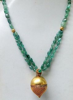 "An exclusive beautiful tribal pendant necklace from Rajasthan northern India. We sourced this piece of gem from a well known tribal family on the outskirts of Jodhpur. Solid well made 22 karat Gold sphere , the bottom half has tiny granulation ending with a tiny ball, the top half is quite shiny finish, set with a natural high grade Columbian emerald and strung with Emerald oval shape (cabochon) and gold beads. Ending with a beautiful gold s clasp. Total length-48 cm(18.72\")we can adjust lengt Traditional Gemstone Round Pendant Necklace, Traditional Round Pendant Necklace With Gemstone, Temple Jewelry With Gemstone Beads For Rituals, Traditional Round Pendant Jewelry With Gemstone Beads, Traditional Gemstone Beaded Round Pendant, Traditional Green Gemstone Beads And Cabochons, Traditional Gemstone Necklaces For Rituals, Traditional Gemstone Necklace For Rituals, Traditional Green Gemstone Beads