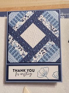 a close up of a thank you card with scissors