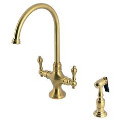 an antique brass faucet with two handles