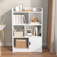 a white book shelf with books and other items