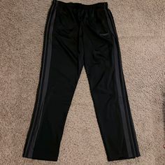 Adidas Mens Black Track Pants With Gray Stripes On Sides, Size Large. Elastic Waist With Drawstring. Tags Taken Off But Never Worn, Brand New Condition. Smoke Free/Pet Free Home. Ships Same Or Next Day. Adidas Gray Sports Pants, Adidas Sports Pants In Gray, Adidas Black Full Length Bottoms, Adidas Black Pants With Pockets, Adidas Black Pants For Streetwear, Black Track Pants, Pants Adidas, Adidas Mens, Gray Stripes