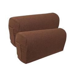 two brown pillows sitting next to each other