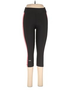 the leggings are black and pink, with an under - bellyed woman's torso