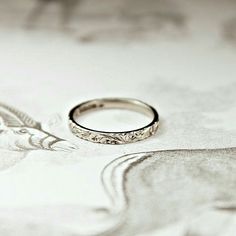 a wedding ring sitting on top of a table