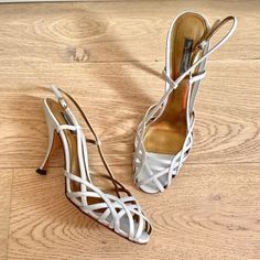 Stunning Dolce & Gabbana Silver Slingback Strappy Sandals!! Beautiful Woven Design Across The Toes, 4 Inch Stiletto Heels, And Ankle Closure. Women’s Size 8.5 (Euro Size 39.5). Made In Italy From Leather. Only Worn Twice!! Wear At The Forefoot But The Heel And Body Of The Shoes Are In Excellent Condition! Silver Color. Gorgeous Shoes! Elegant White Slingback Sandals With Round Toe, White Open Heel Slingback Sandals For Evening, Elegant White Slingback Evening Sandals, Elegant White Slingback Sandals For Evening, Luxury Leather Sole Slingback Sandals For Party, White Leather Slingback Sandals For Party, White Leather Sandals For Gala, Party Slingback Sandals With Ankle Strap And Leather Sole, Designer Slingback Sandals With Leather Sole For Evening