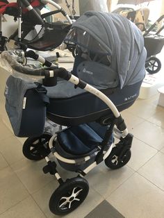 a baby stroller sitting on the floor in a store