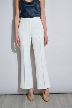 Fall in love with the season 's must have Wide Leg Pant. It features a mid-rise waist, fly front closure and fluid pin tuck details. Designed with a flattering flare at the hem, it 's perfect worn as a suit with its matching single button blazer or as a separate - this pant is the must have addition to your wardrobe. T-Tahari Wide Leg Pintuck Fit & Flare Pant Runs true to size. Model is 5'9" and wearing size 2 Dry Clean Only Imported Style #: THF41043 White Flare Pants, White Flares, Flare Pant, Single Button Blazer, White Star, Wide Leg Pant, Blazer Buttons, Pair Of Pants, Pin Tucks