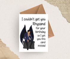 a card with an illustration of a man sitting on a chair and the words, i couldn't get you rhysand for your birthday so got you this card instead