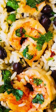 rice with shrimp, black beans and cilantro on it