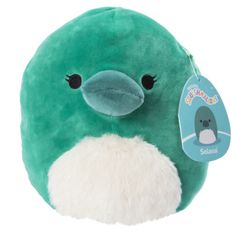 a green stuffed animal with a tag on it's ear