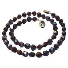 The length of the necklace is 22 inches (56 cm). The size of the faceted beads is 10 mm. Beads are a hand-faceted, deep-saturated, uniform color. The color of the beads is authentic and natural. No thermal or other mechanical treatments were used. The necklace is fastened with a silver handmade clasp with faceted natural garnet. The beads knotting is traditionally done with silk thread, placing a knot between each bead to prevent them from rubbing against each other. The weight of the necklace i