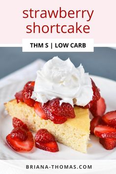 a slice of strawberry shortcake on a white plate with whipped cream and strawberries