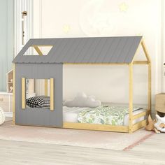 a child's bed with a gray roof