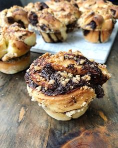 several pastries sitting on top of a wooden table