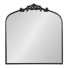 an ornate metal frame mirror on a white background with black trimmings and scrolls