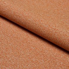 an orange fabric with white dots on it