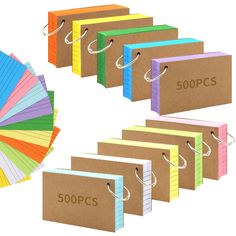 several folders with different colored paper on each side and the word 500 pcs written in large letters